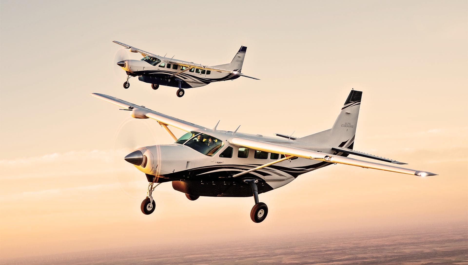 Charter aircraft over sunset